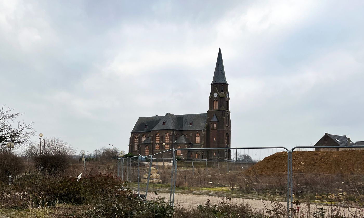 "The vacated church in Manheim. All windows have been barricaded. In the front you see some construction fences."